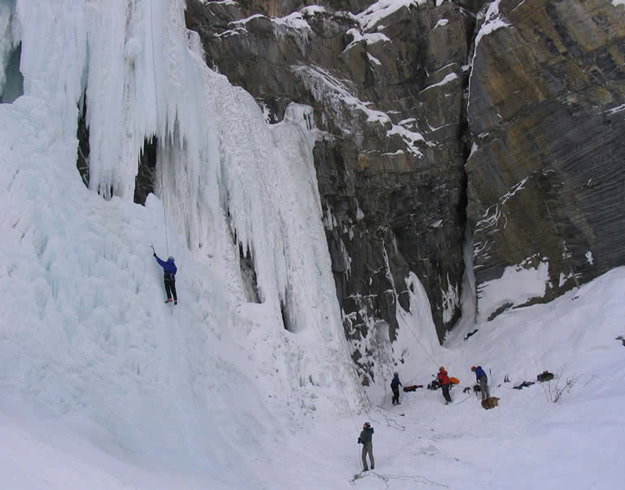 Climbers on the first pitch of Pilsner Pillar (215 m III, Wl 6) To the right, climbers working a mixed route.