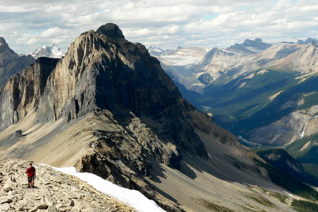 Approaching the summit of Mount Field, with Wapta Mountain looming. Can you find Takakkaw Falls in the valley below?
